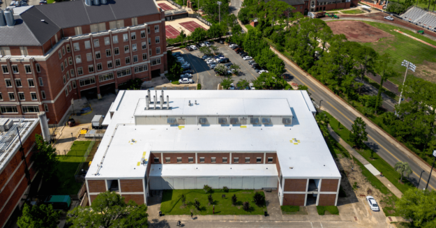 Blog Header for Perry Roofing Blog Boosting Longevity Commercial. Image of a commercial roof.